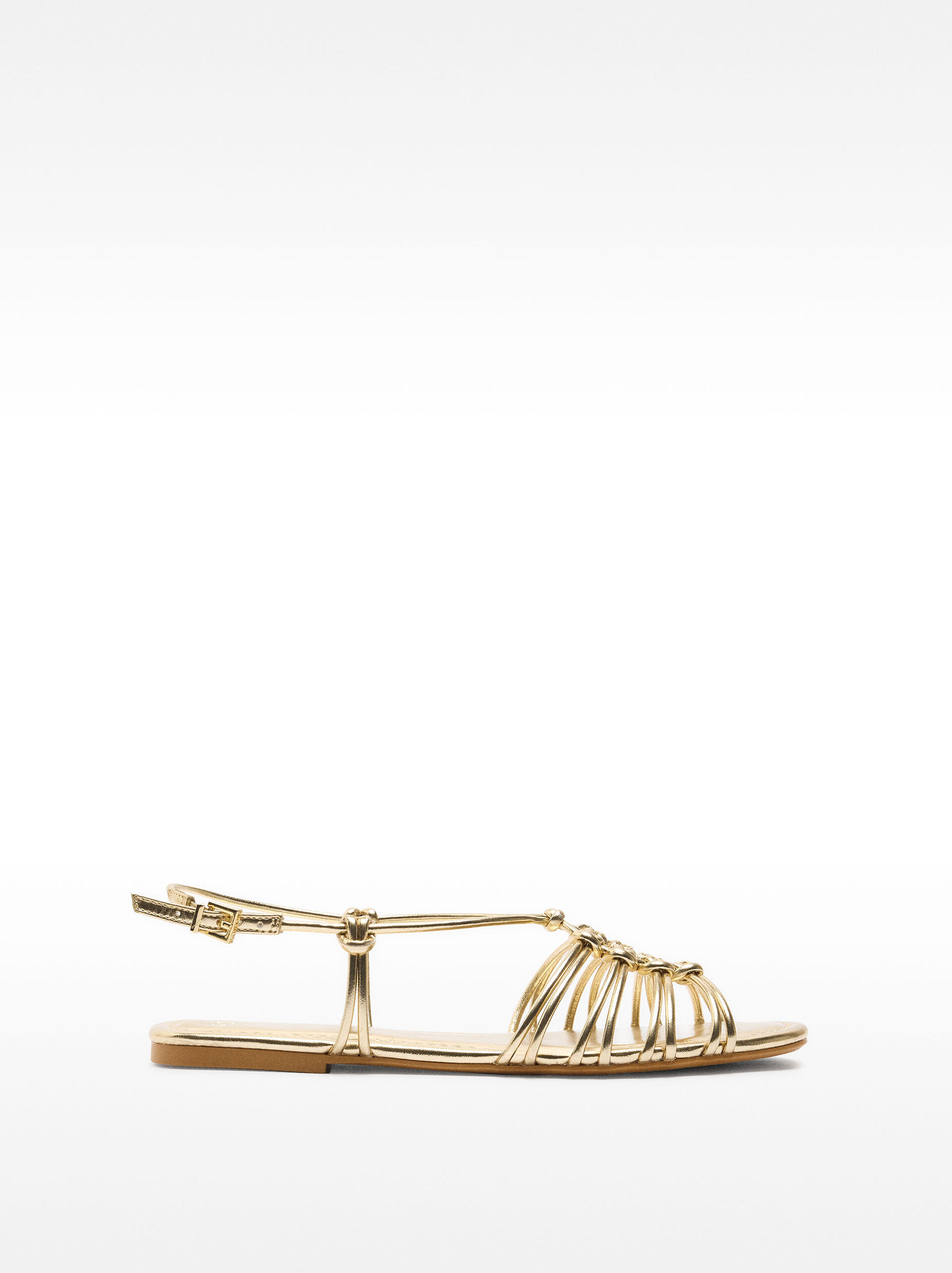 Metallic flat sandals with straps and knots image number 1.0