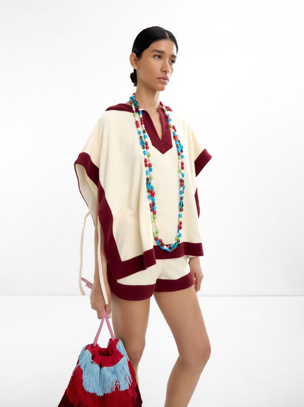 Cotton poncho with contrasting colors