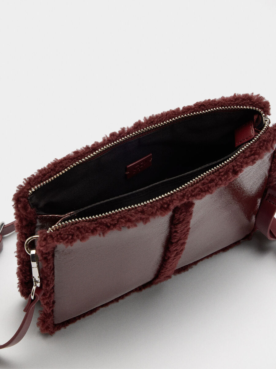 Crossbody bag with fur-effect edges