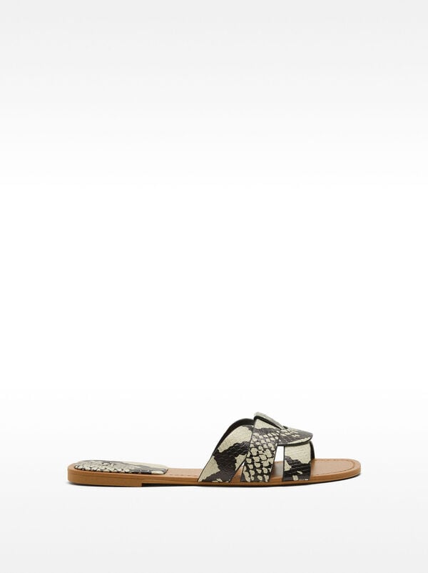 Flat crossover sandals with animal embossing