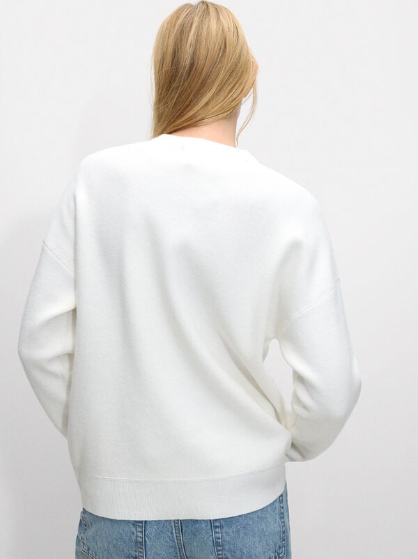Knitted sweater with embroidery