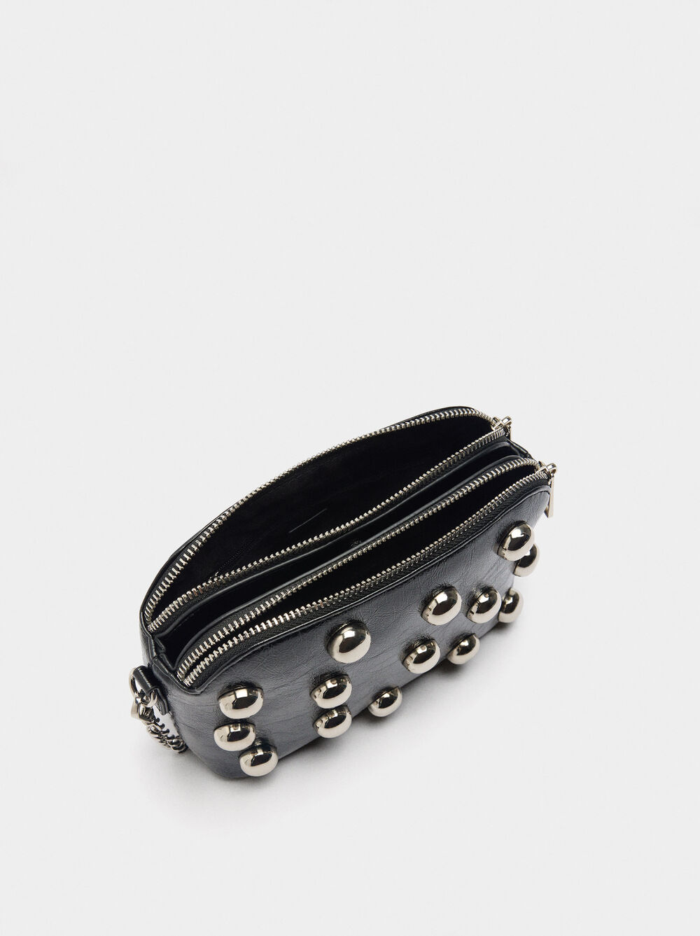 Crossbody bag with metallic spheres