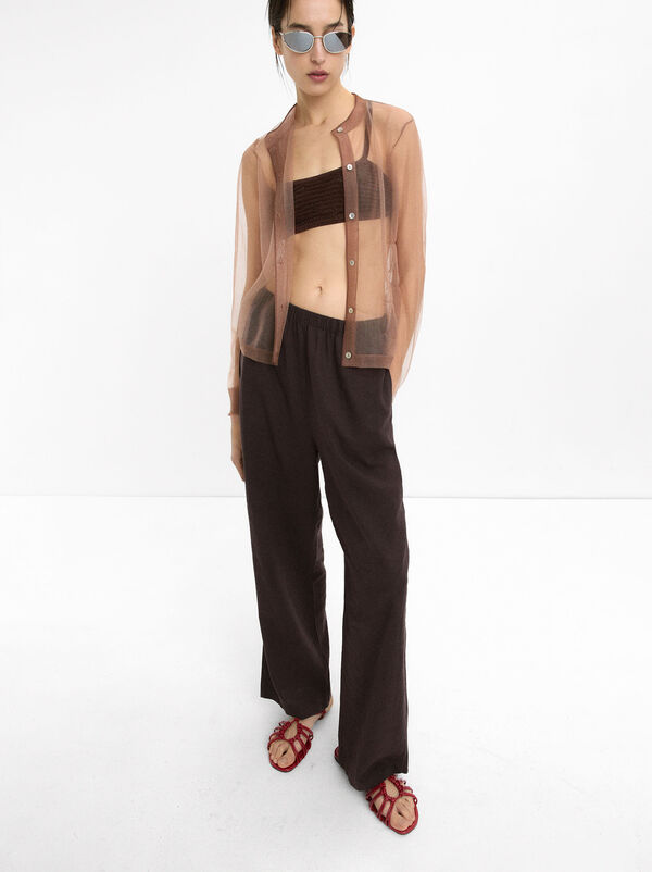 Flat sandals with straps and knots