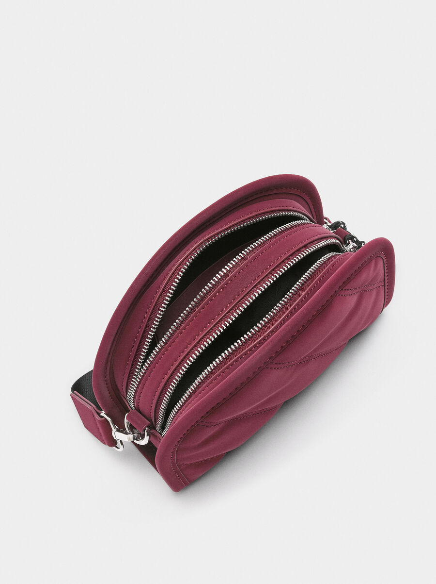 Crossbody bag with soft texture and pendant