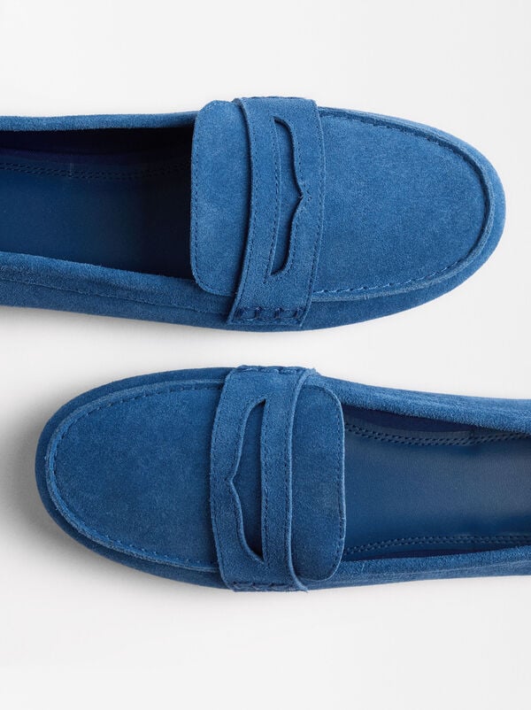 Leather moccasins with stitching