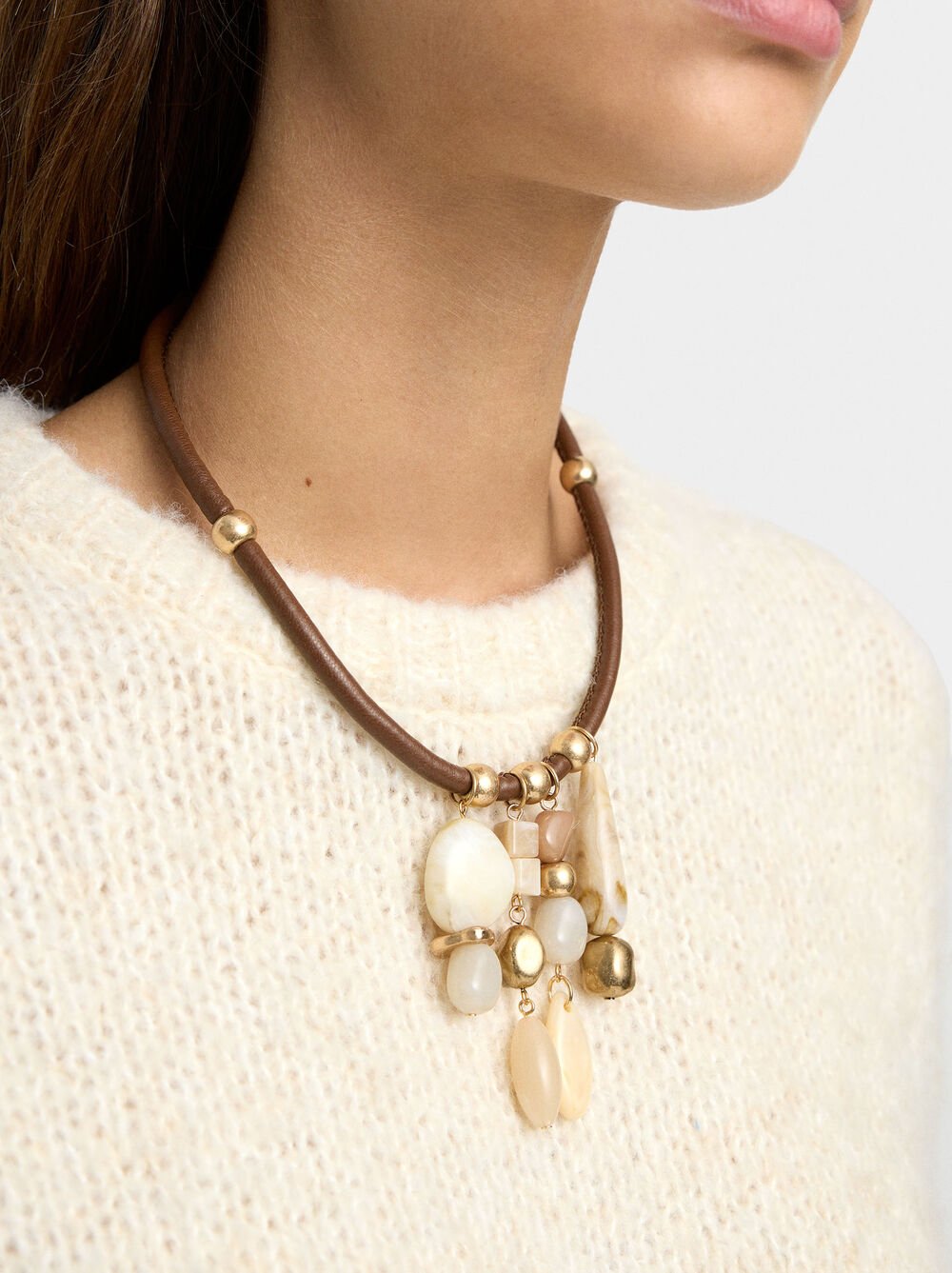 Necklace with cord and stone-effect pendants
