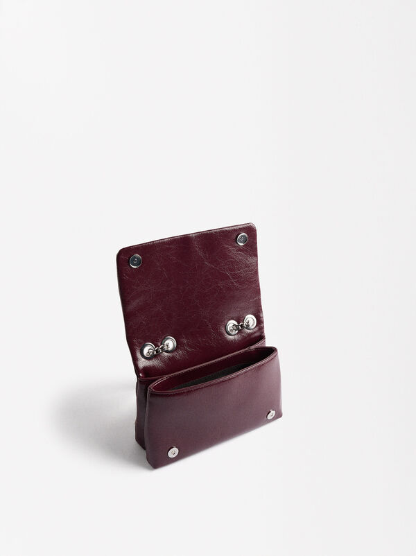 Shoulder bag with studs flap closure
