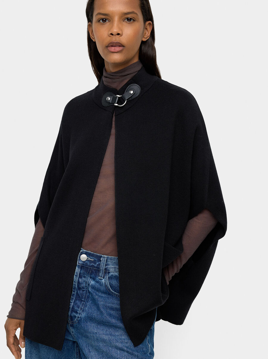 Knit poncho with high neck