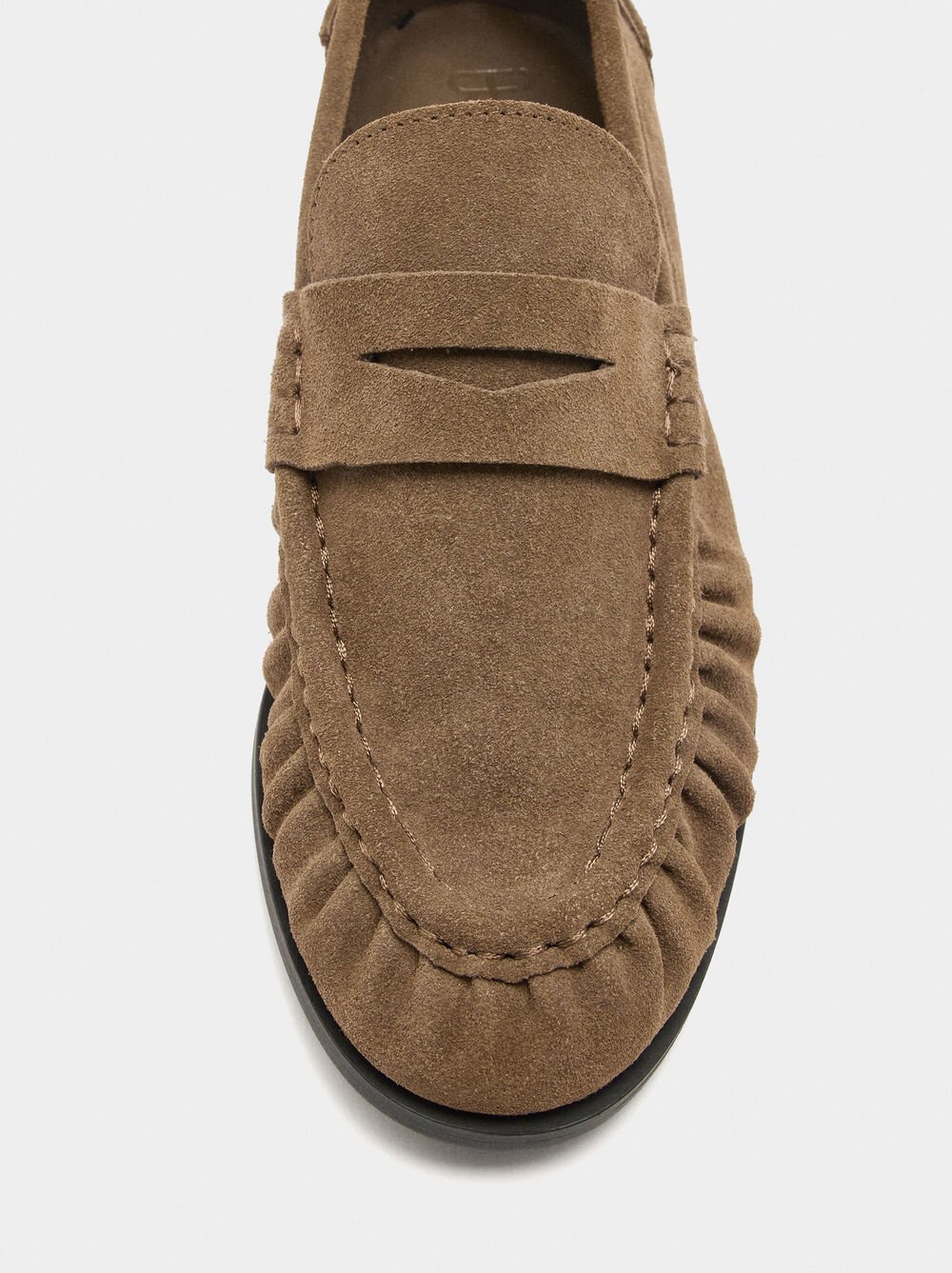 Leather moccasins with stitching