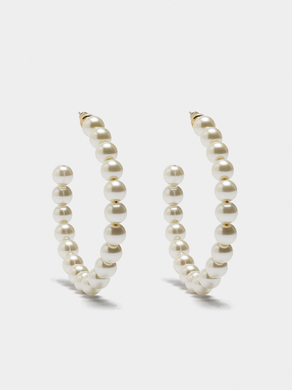 Open hoop earrings with pearls