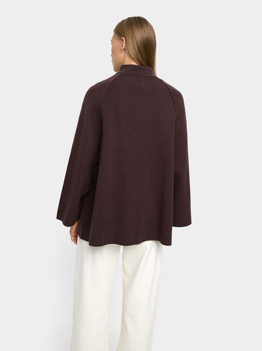 Knit poncho with high neck