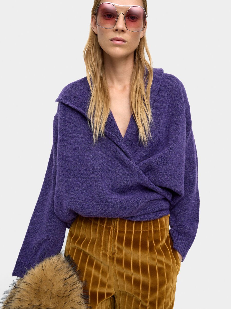 Knit sweater with crossover