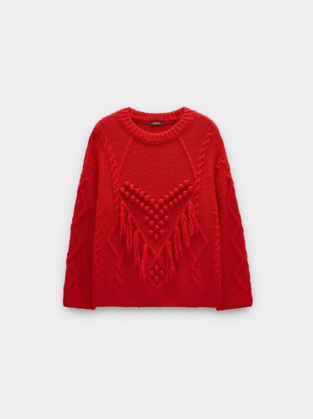 Knit sweater with fringes and reliefs
