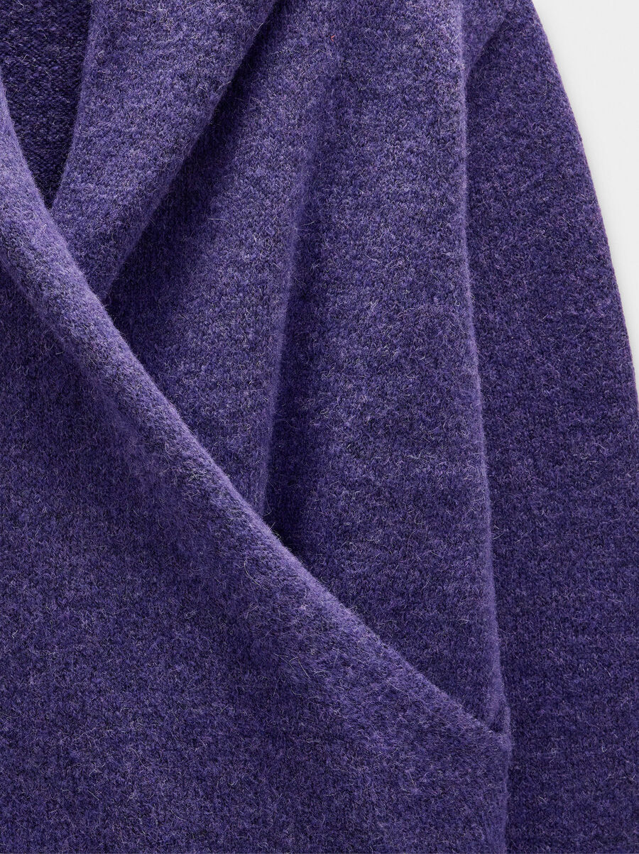 Knit sweater with crossover