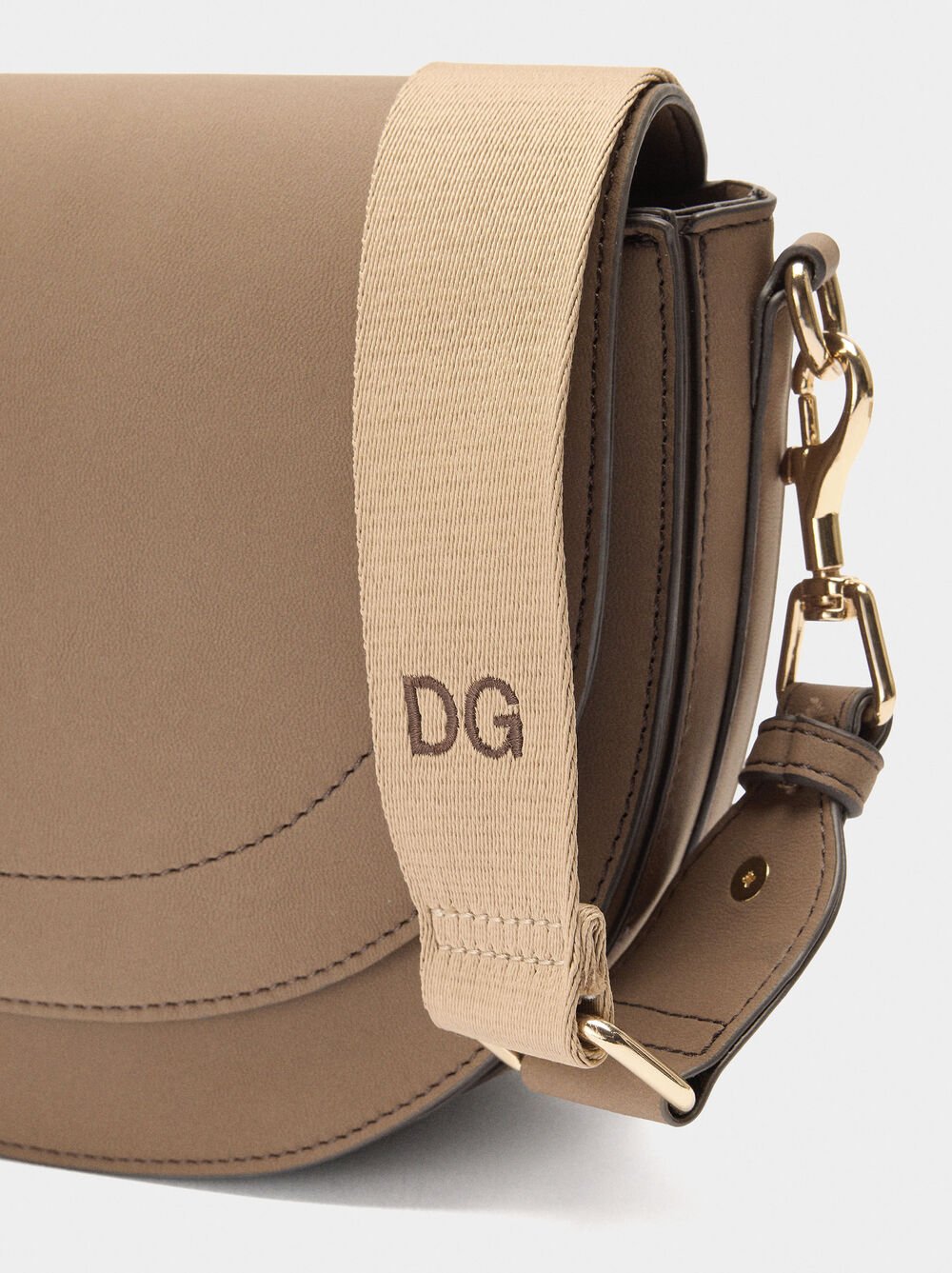 Oval crossbody bag with flap