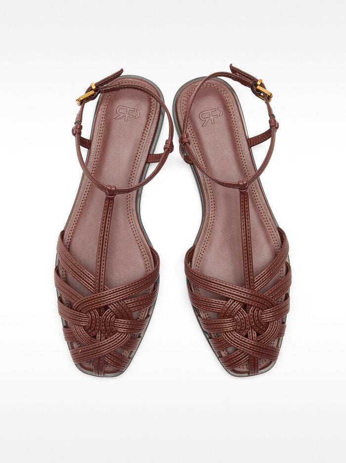 Flat sandals with braided straps