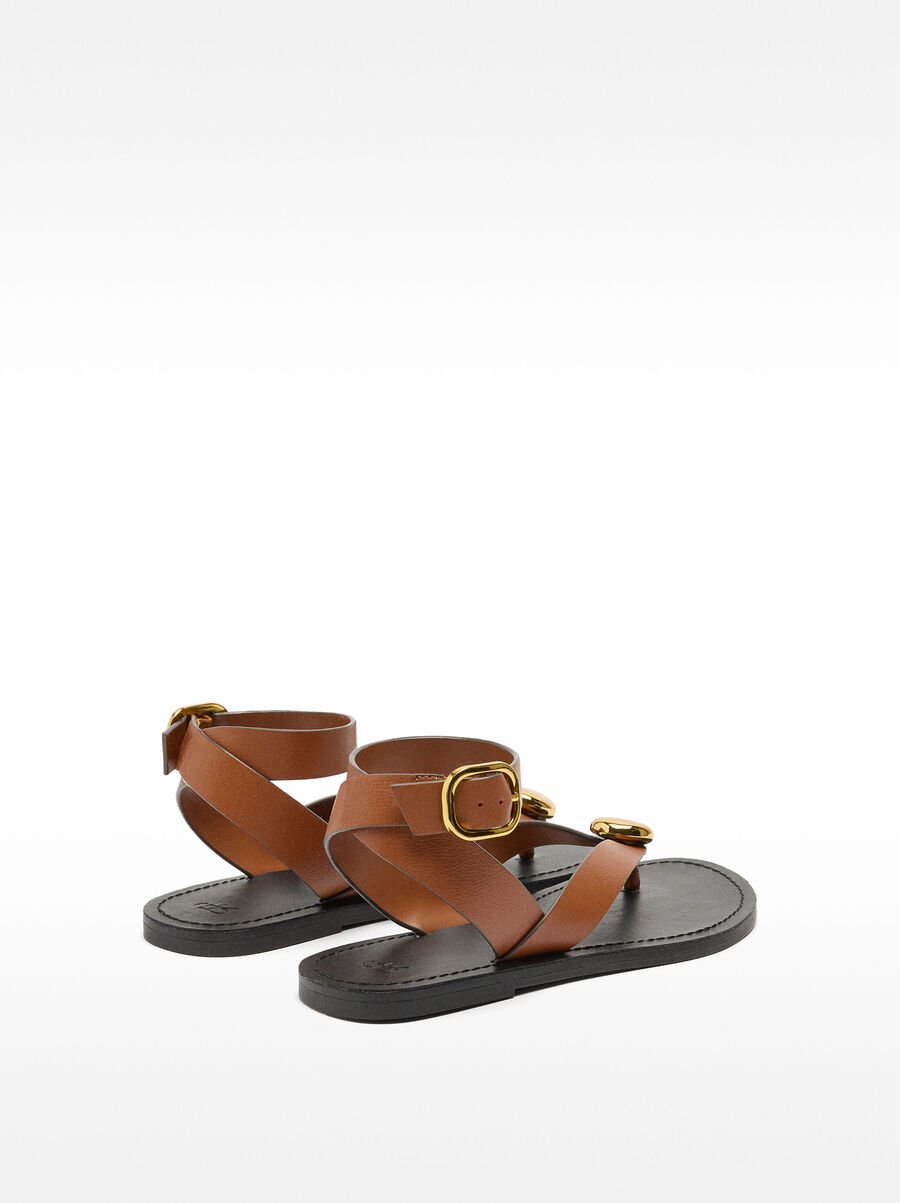 Leather flat sandals with metallic detail