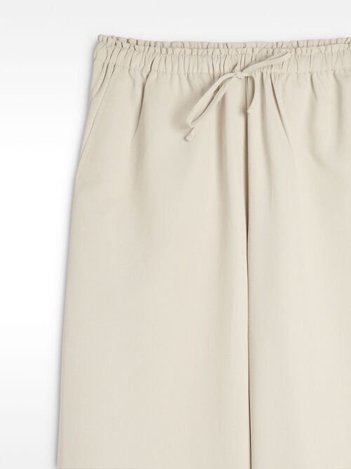 Trousers with elastic waist and adjustable cord
