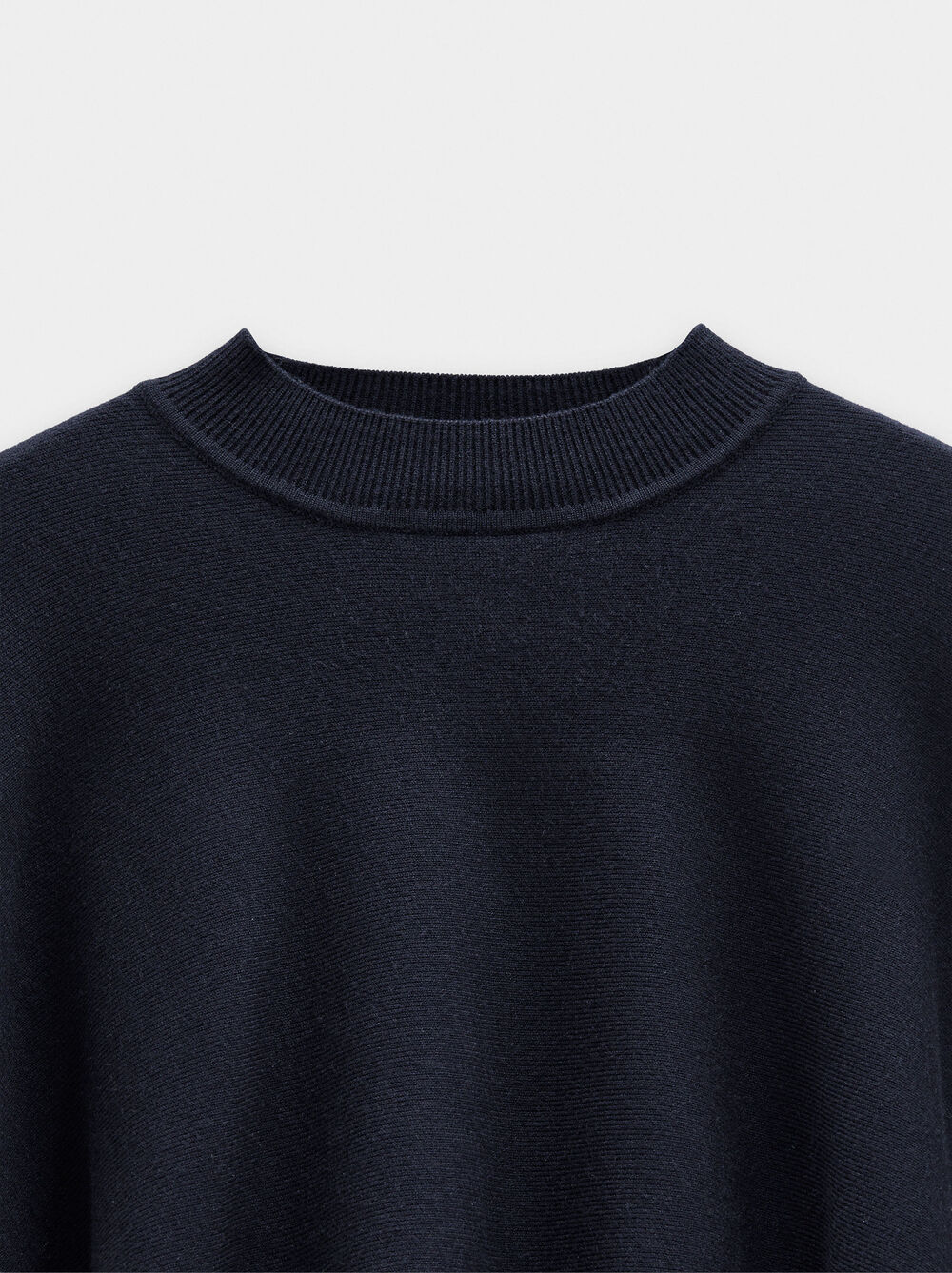 Asymmetric knit poncho