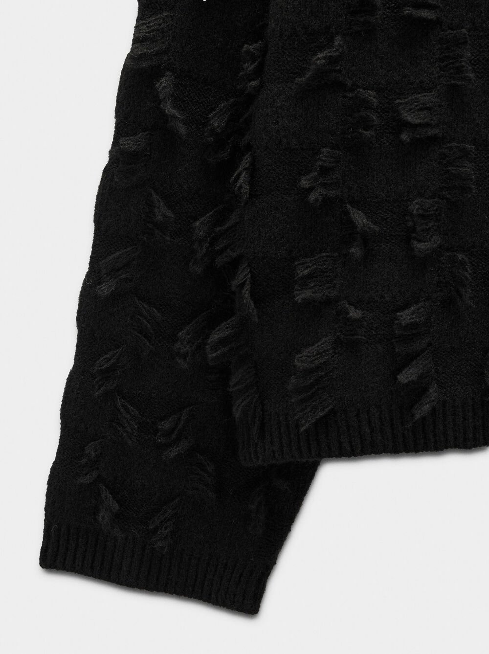 Knitted jumper with fringes