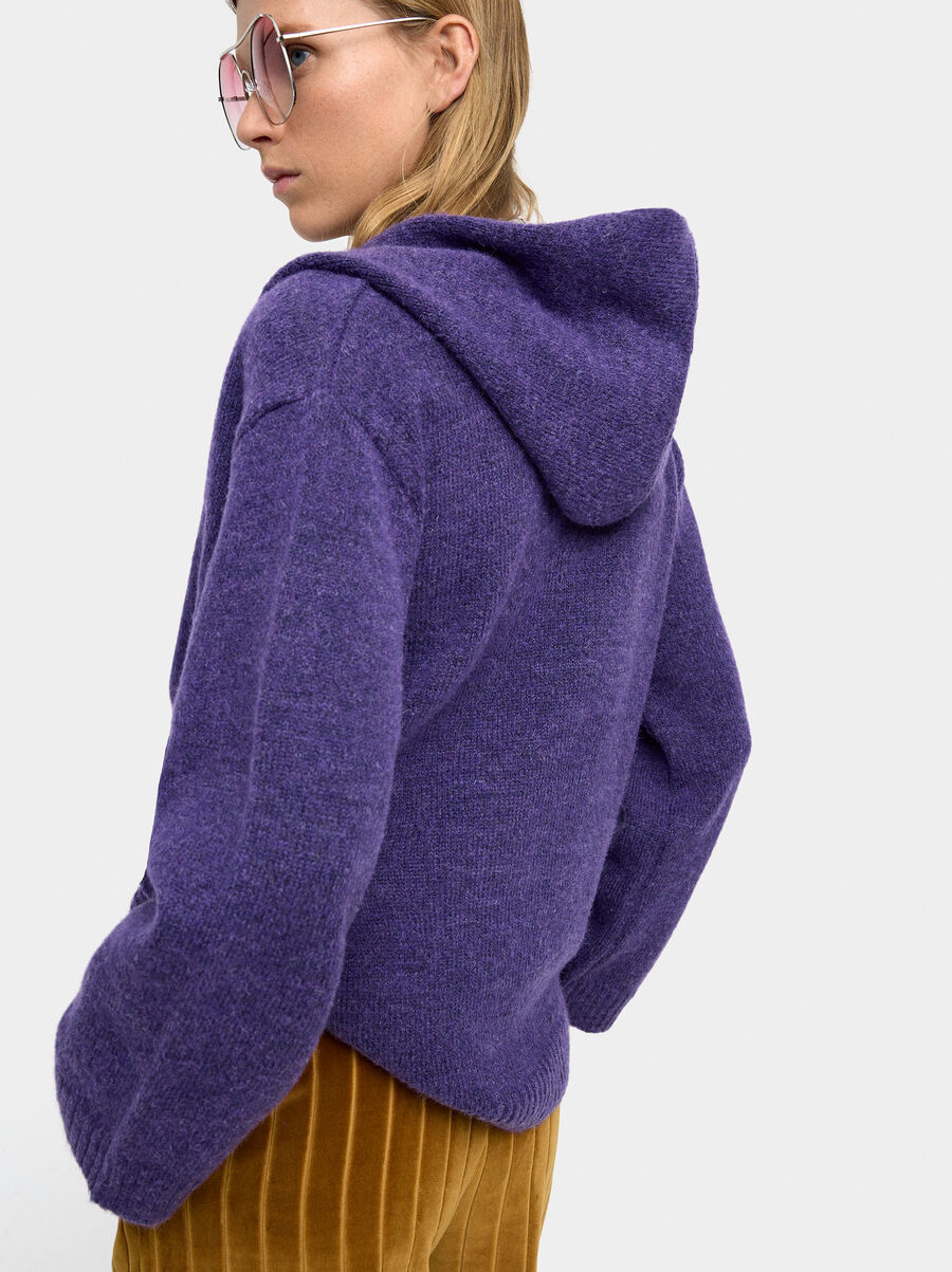 Knit sweater with crossover