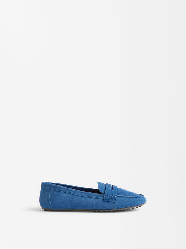 Leather moccasins with stitching