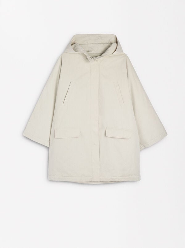 Cape with hood and pockets