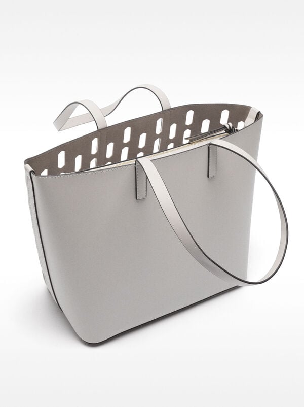 Perforated shopper bag with removable pouch