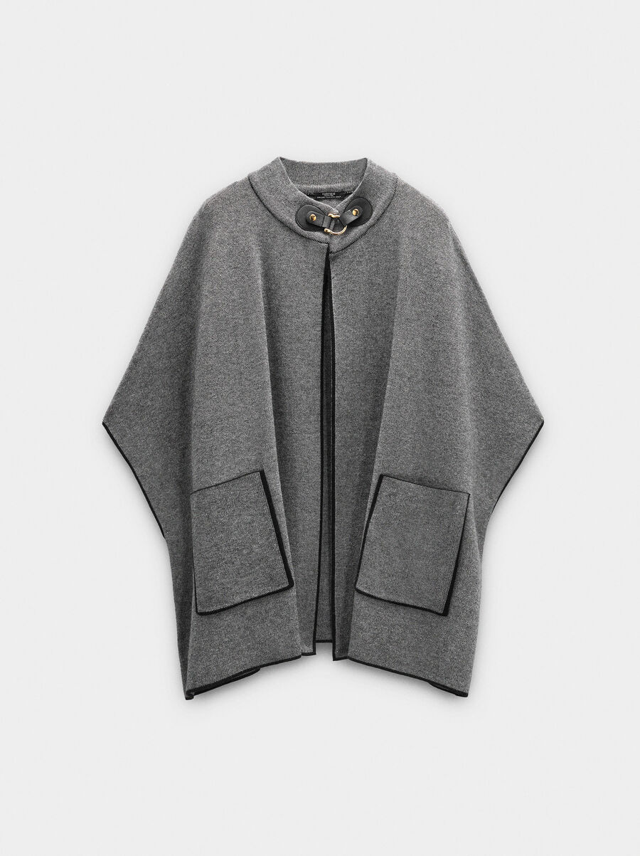 Knitted poncho with stitching detail