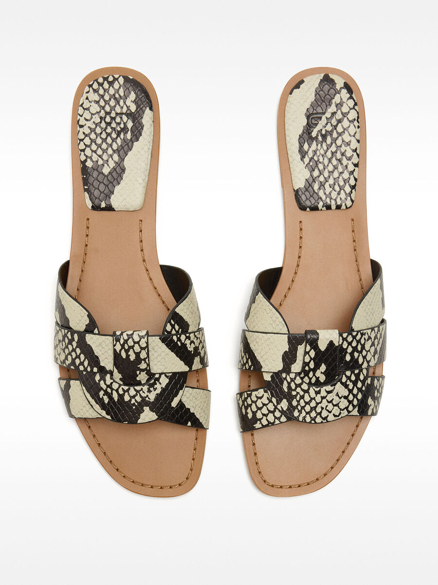 Flat crossover sandals with animal embossing