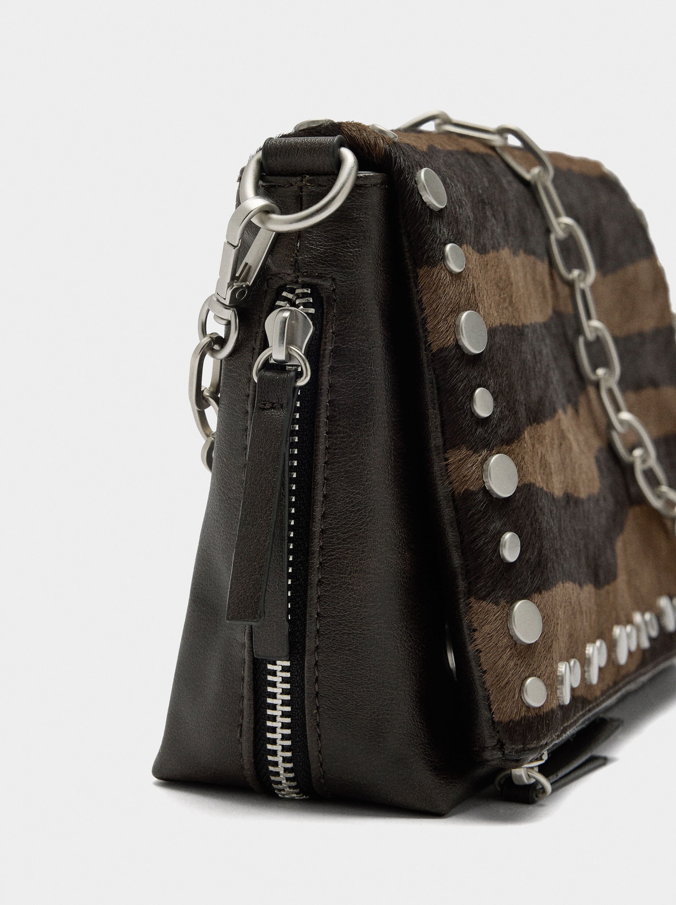 Shoulder bag with leather and studs details image number 1.0