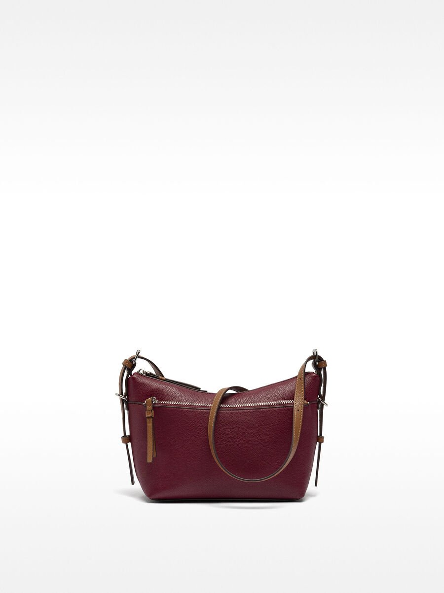 Crossbody bag with exterior pocket