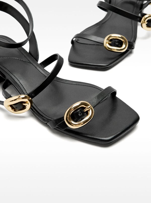 Sandals with straps and buckles