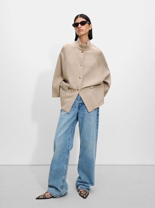 Knit poncho with high neck