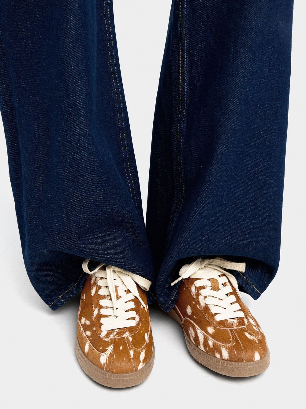 Leather sneakers with animal print