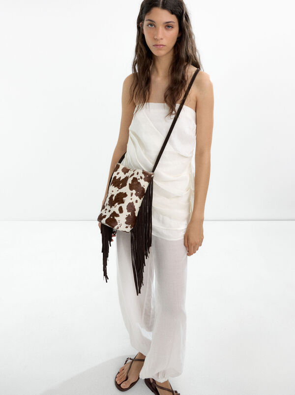 Leather bucket bag with fringes