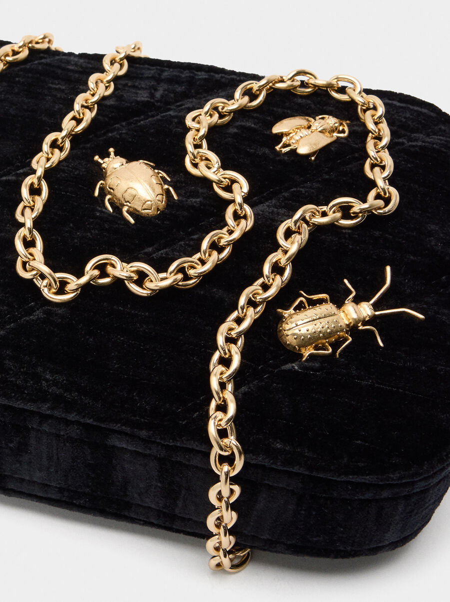 Bolso de fiesta aterciopelado con insectos