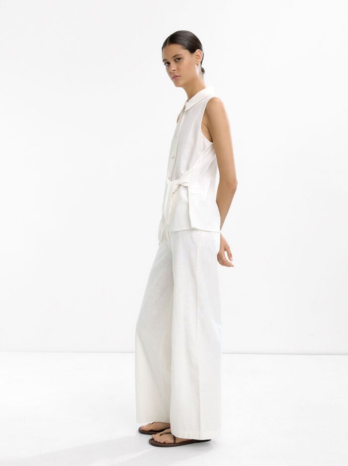 Top with embroidery and knot