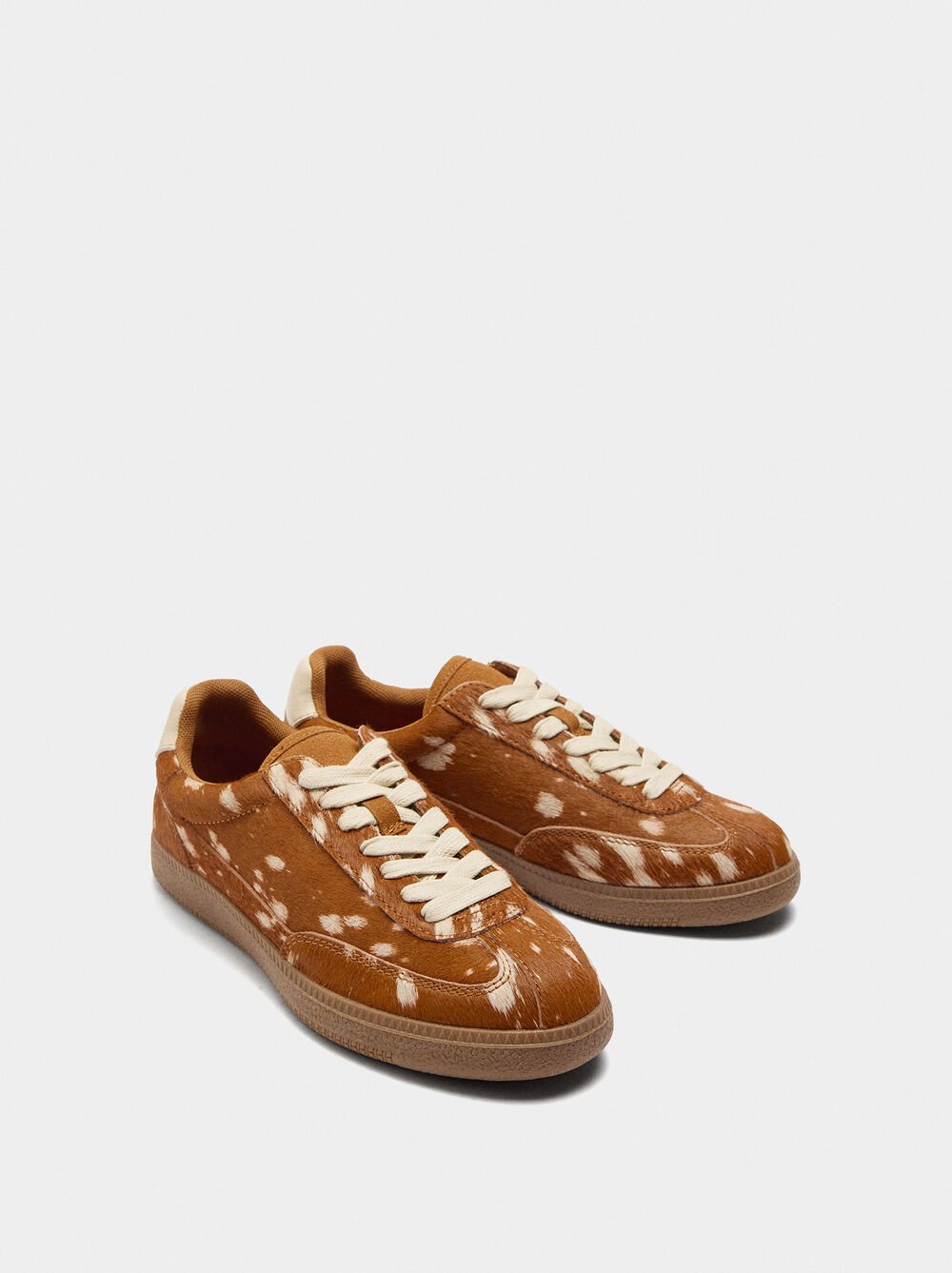 Leather sneakers with animal print