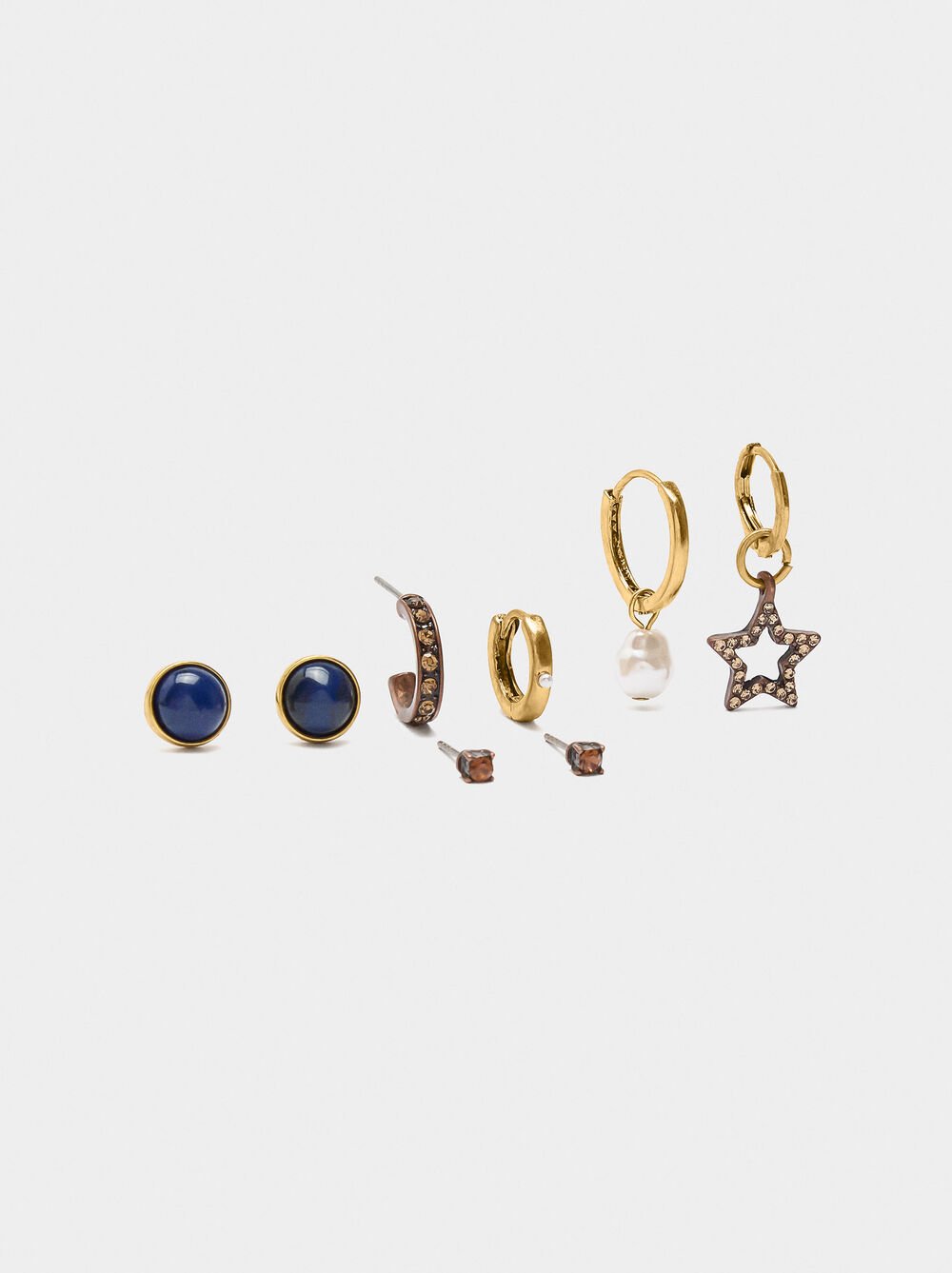Set of earrings with star and pearl