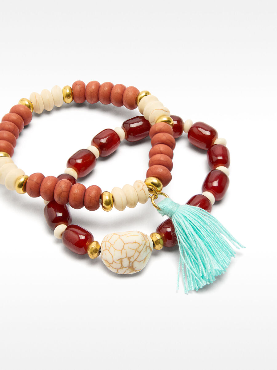Set of elastic bracelets with tassel