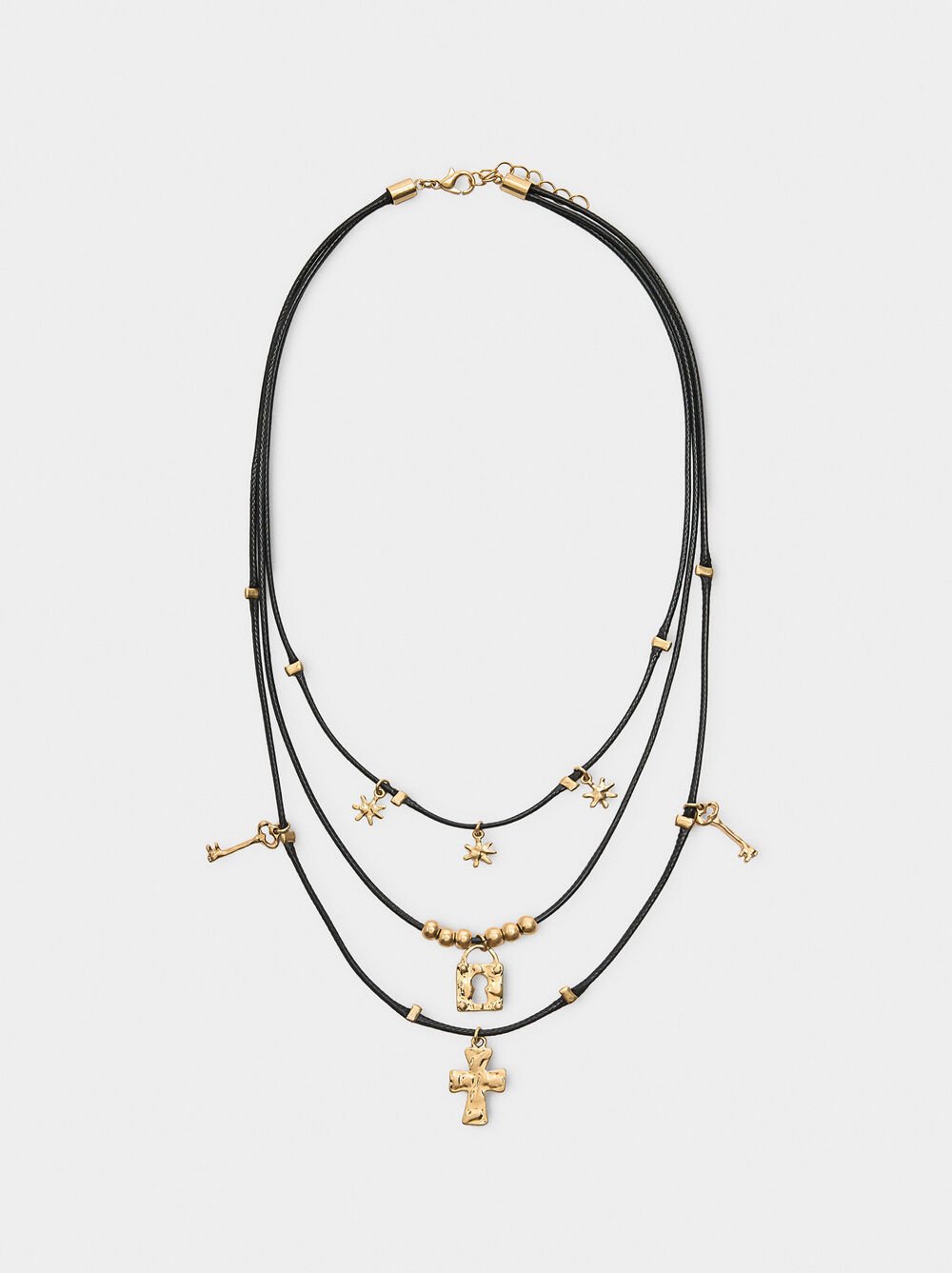 Triple necklace with pendants and charms