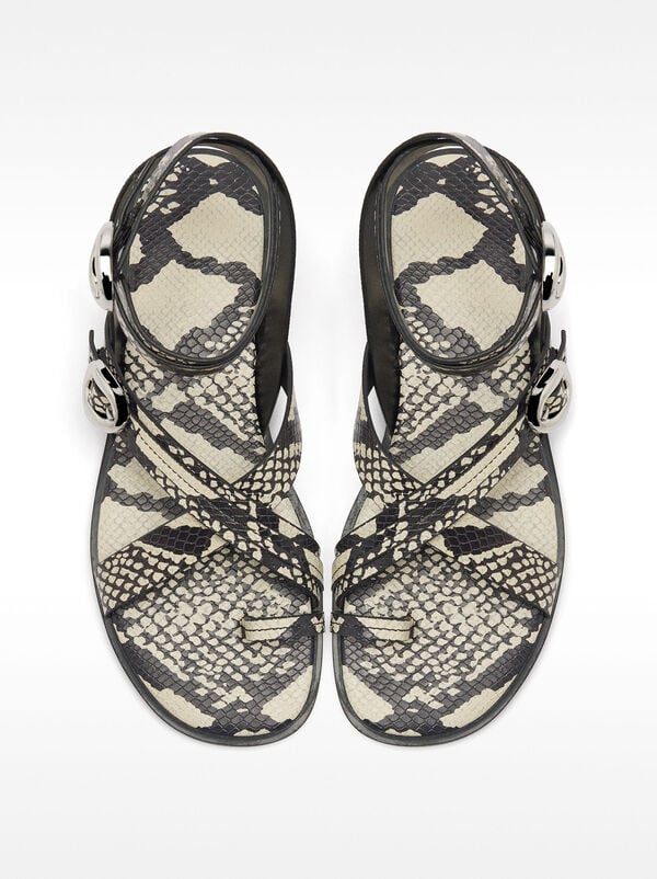 Flat sandals with snake print