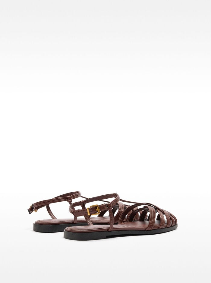 Flat sandals with braided straps