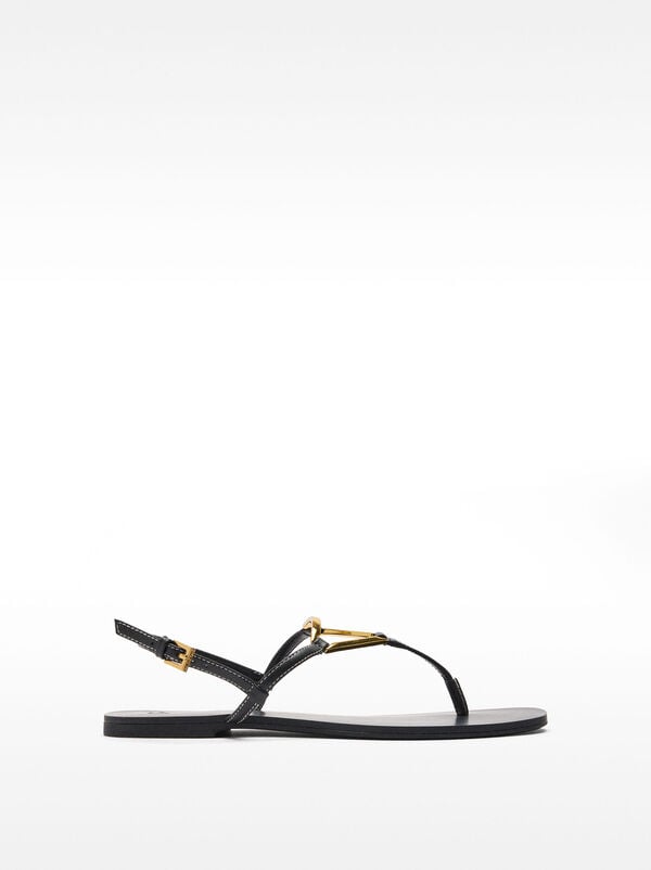 Flat sandals with metallic detail straps