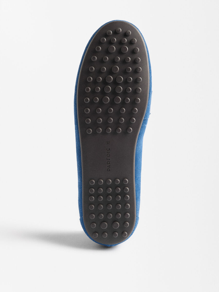 Leather moccasins with stitching