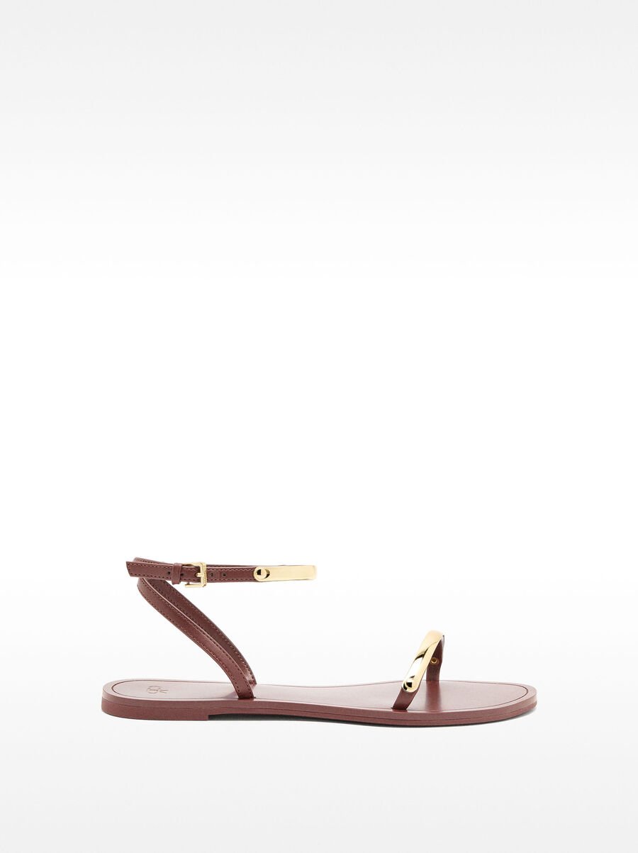 Flat sandals with metallic details