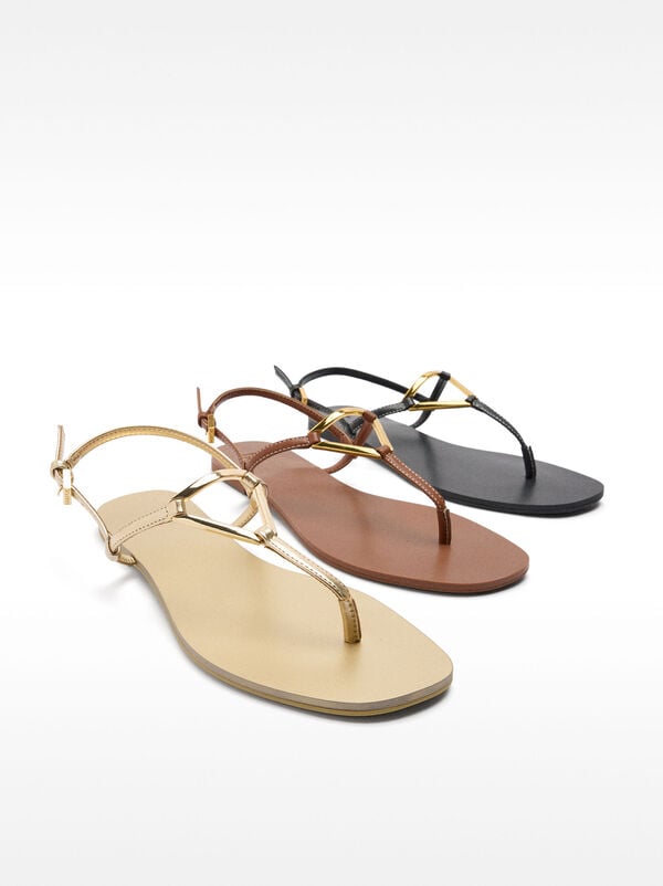 Flat sandals with metallic detail straps