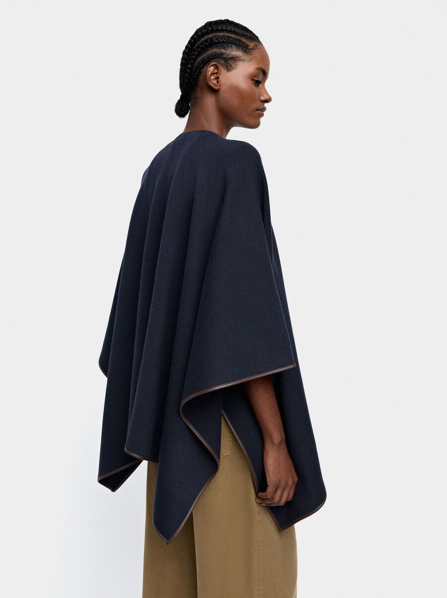 Knitted poncho with stitching detail