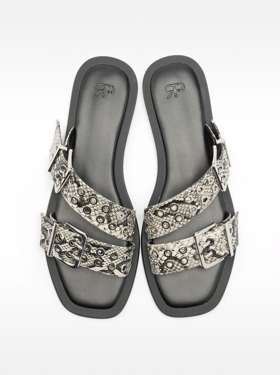 Flat sandals with buckles and studs